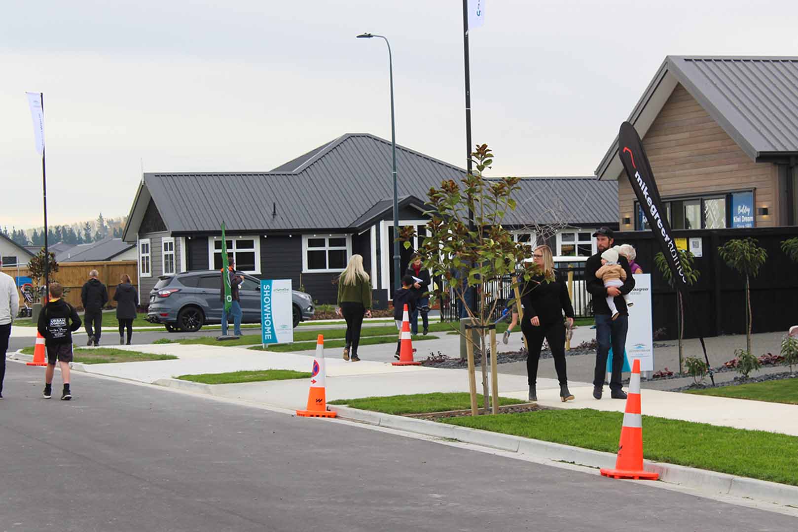 people walking around Silverstream subdivision showhome village