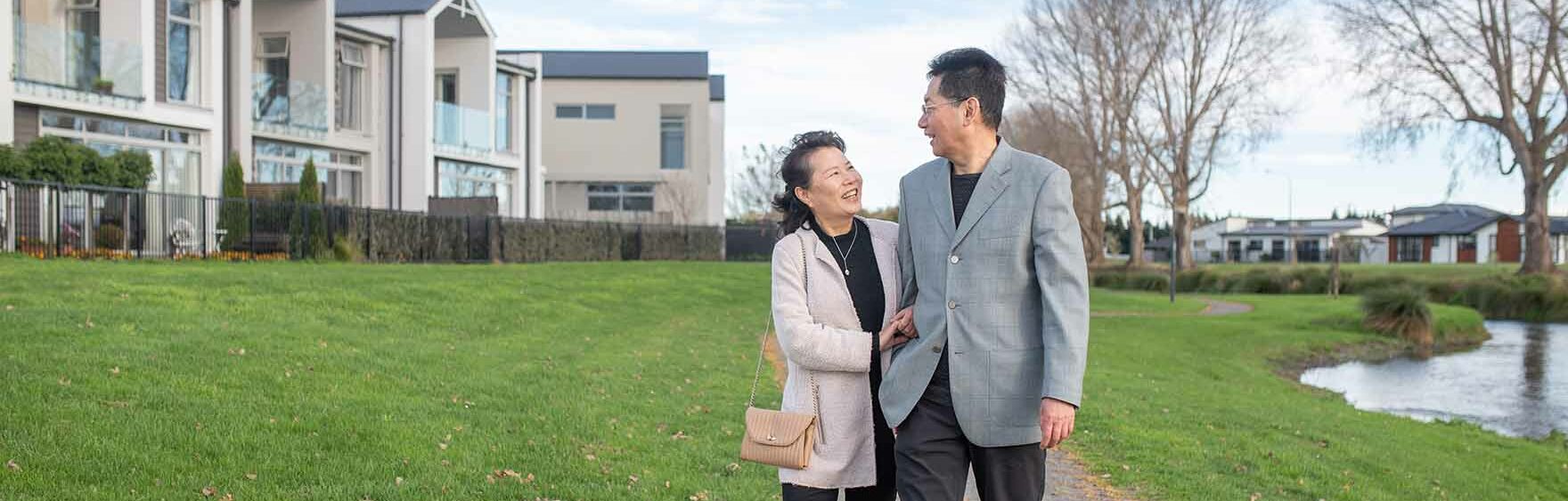 Couple walking by the river running through Silverstream