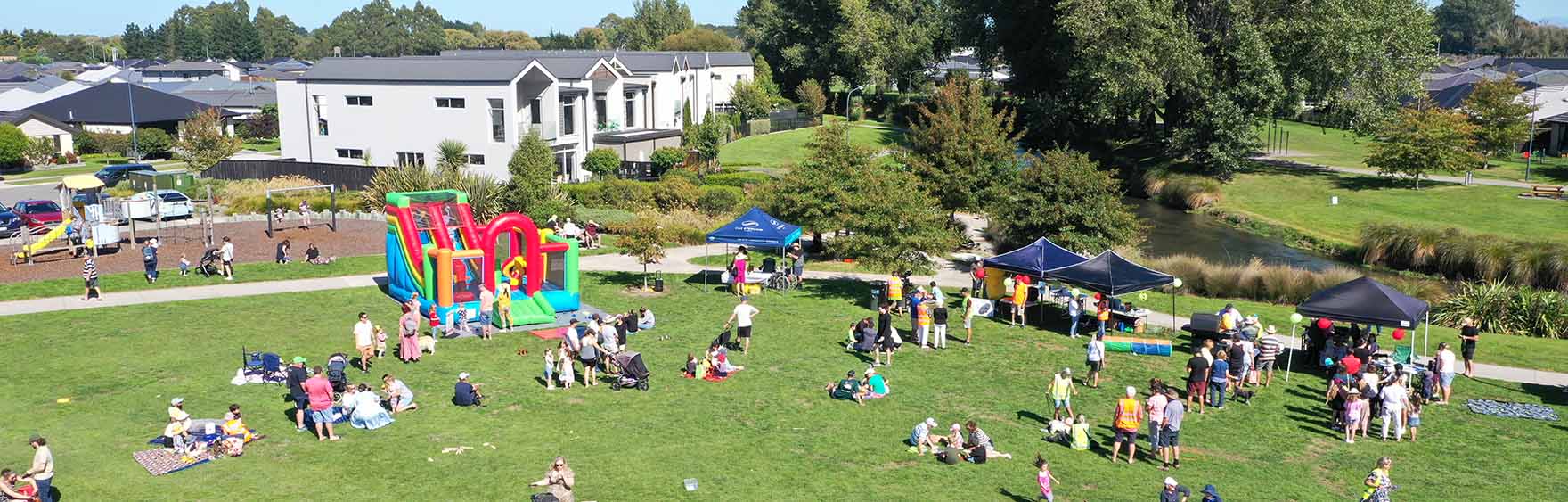 Drone image of bouncy castle and tents setup in Silverstream green space